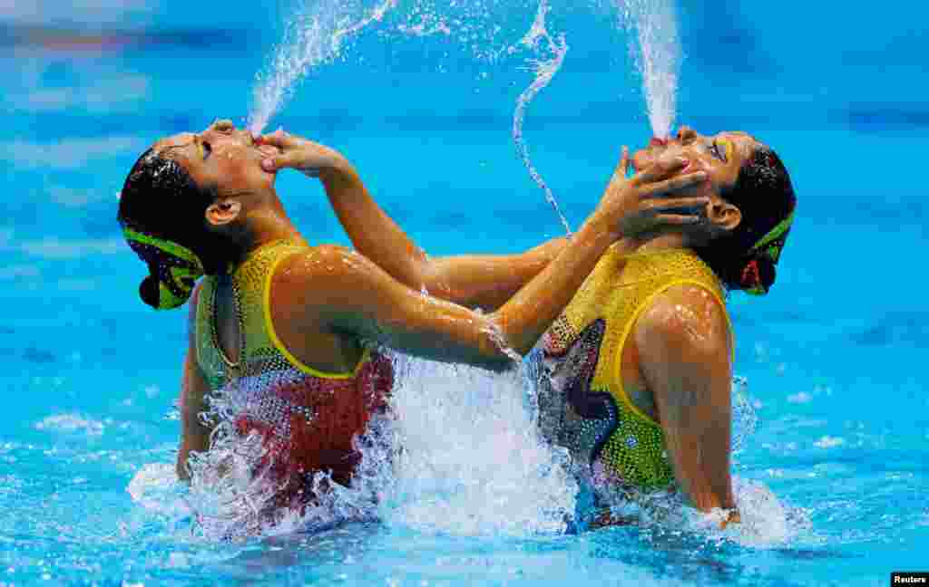 Mexico's Isabel Delgado Plancarte and Nuria Diosdado Garcia perform in the synchronized swimming duets free routine qualification round.
