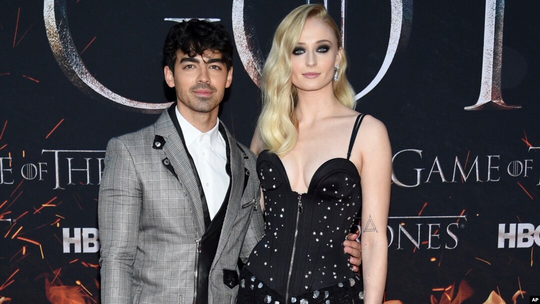 FILE - Actress Sophie Turner, right, and boyfriend musician Joe Jonas attend HBO's "Game of Thrones" final season premiere at Radio City Music Hall in New York. 