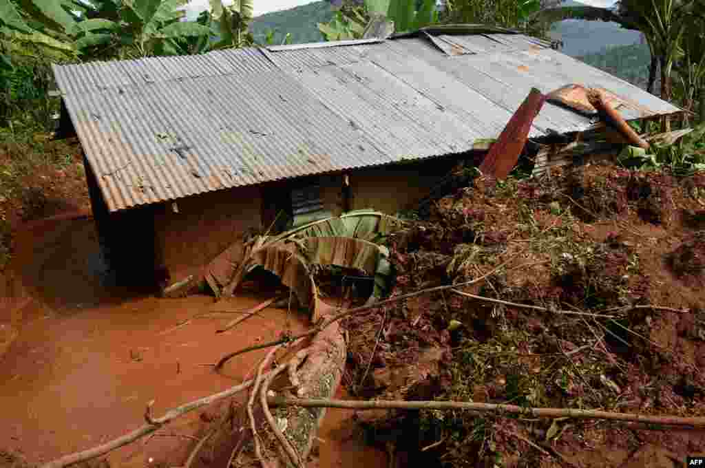 A view of a flooded house at a landslide site in Shisakali village of Bududa district, in eastern Uganda.