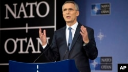 FILE - NATO Secretary General Jens Stoltenberg speaks during a media conference after a meeting of NATO defense ministers at NATO headquarters in Brussels.