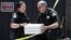T. Abbott, left, and John Lopes from the Sacramento County Sheriff's crime scene investigation office discuss boxes of evidence gathered from the home of murder suspect Joseph DeAngelo, April 26, 2018, in Citrus Heights, Calif.