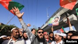 Supporters of the Pakistan Tehreek-e-Insaf, political party, chant slogans accusing the U.S. of plotting to overthrow Pakistani Prime Minister Imran Khan, during a protest in Peshawar, April 4, 2022.