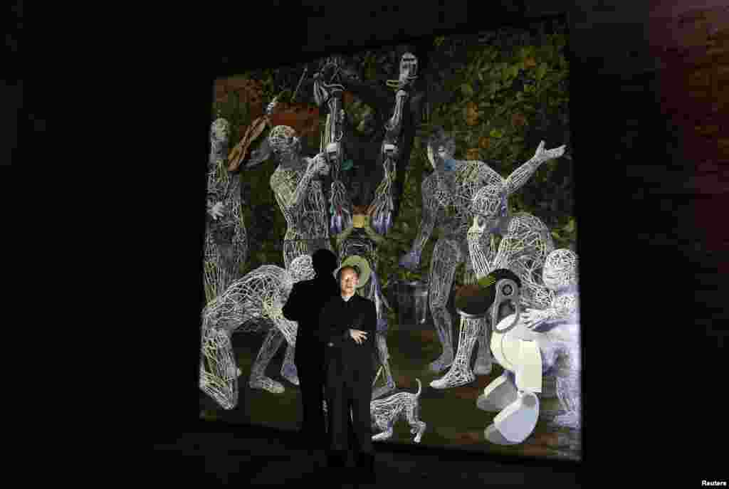 Chinese artist Miao Xiaochun pose near his installation called &quot;Transfiguration&quot; at the China pavilion, May 28, 2013.