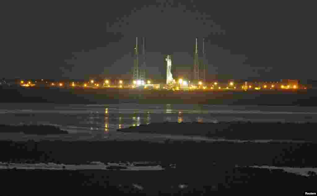 The unmanned Falcon 9 rocket being launched by SpaceX on a cargo resupply service mission to the International Space Station sits on the launch pad after an aborted liftoff from the Cape Canaveral Air Force Station in Cape Canaveral, Florida, Jan. 6, 2015.