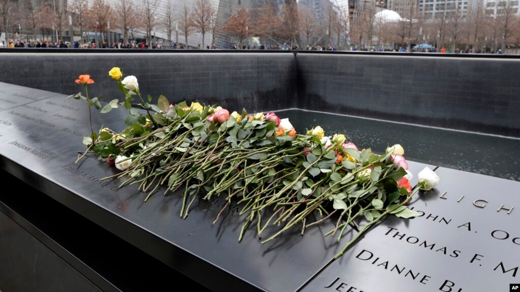 Roses are placed on the 9/11 Memorial during 25th anniversary ceremony to commemorate the six victims of the 1993 World Trade Center bombing, in New York, Feb. 26, 2018.