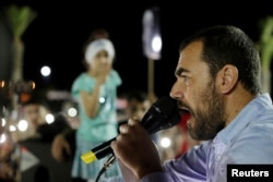 FILE - Nasser Zefzafi, Moroccan activist and the leader of Hirak, gives a speech during a demonstration against injustice and corruption in the northern town of Al-Hoceima, Morocco, May 18, 2017.