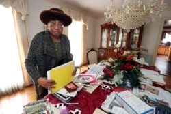 Mother Mary Patterson, stands at her dining room table in her Memphis, Tenn., home Dec. 1, 2021.