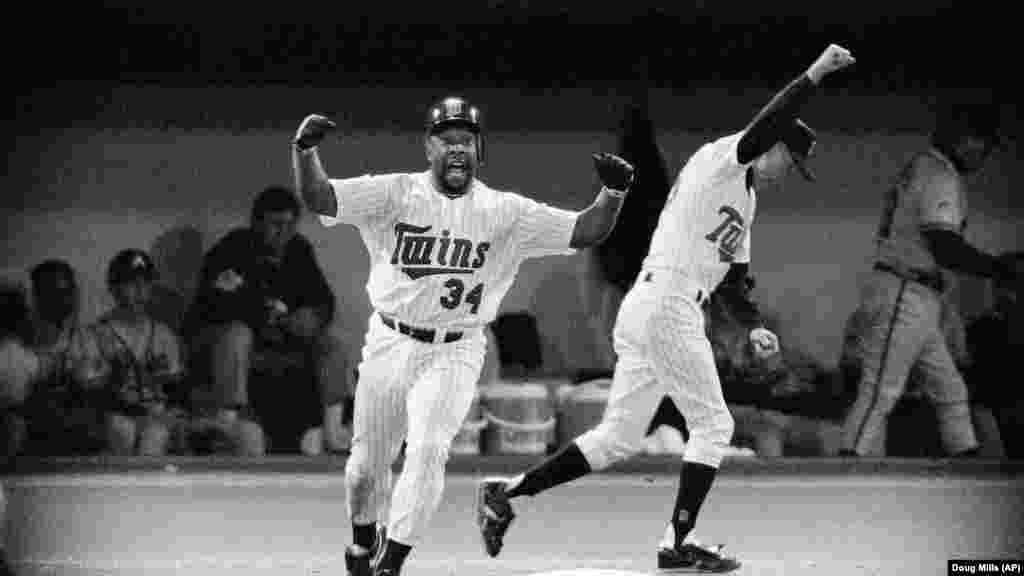 Minnesota Twins Kirby Puckett celebrates his 11th inning homerun in Game 6 to tie the World Series against the Atlanta Braves in Minneapolis Oct. 26, 1991. Minnesota went on to win the championship in the next game.