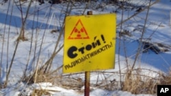 A sign on the perimeter of the 30-kilometer evacuation zone around the Chernobyl nuclear plant reads "Stop! Radioactive Zone." (VOA - Taras Burnos)