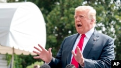 President Donald Trump speaks to reporters on the South Lawn of the White House in Washington, Aug. 17, 2018.