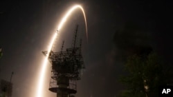 The Soyuz-FG rocket booster with Soyuz TMA-13M space ship carrying a new crew to the International Space Station, ISS, blasts off at the Russian - leased Baikonur cosmodrome, Kazakhstan, May 29, 2014. 