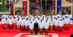 FILE- From left in front row, Cambodia's National Assembly President Heng Samrin, King Norodom Sihamoni, Prime Minister Hun Sen and Minister of Royal Palace Kong Samol pose with the nation's lawmakers during a photo session in front of the National Assembly in Phnom Penh, Cambodia, 2013. (AP Photo)