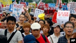 Protesters stage a rally in front of the National Diet (parliament) building in Tokyo, Japan, Aug. 30, 2015.