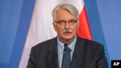 FILE - Polish Foreign Minister Witold Waszczykowski speaks during a press conference in Budapest, Hungary, in February 2016.