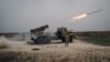 FILE - A rocket is fired from a rocket launcher outside Makhmour, about 75 km (47 miles) east of Mosul, Iraq, March 25, 2016.