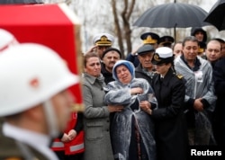 Mother of Koray Karaca, a Turkish soldier who was killed during the operation in Syria's Afrin region, mourns during his death during a funeral ceremony in Istanbul, Turkey Feb. 11, 2018.