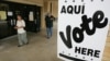 FILE - Hispanic voters leave a San Antonio, Texas, polling place after voting in the 2004 election.
