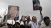 Supporters of Mam Sonando, a 71-year-old radio broadcaster and land-rights campaigner for 20 years, hold a protest calling for his release near Phnom Penh Municipal Court, October 1, 2012. 