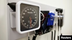 FILE - Medical equipment is pictured on the wall of an examination room in San Diego, California, Nov. 17, 2014.