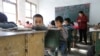 FILE - Students attend class at Pengying School on the outskirts of Beijing.