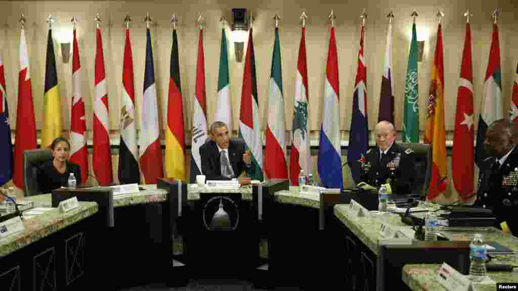 U.S. President Barack Obama speaks at a meeting with more than 20 foreign defense chiefs to discuss the coalition efforts in the ongoing campaign against Islamic State militants at Joint Base Andrews in Washington, Oct. 14, 2014. 