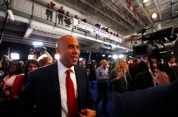 Senator Cory Booker works his way through the spin room after the 2020 Democratic U.S. presidential debate in Houston, Sept. 12, 2019.
