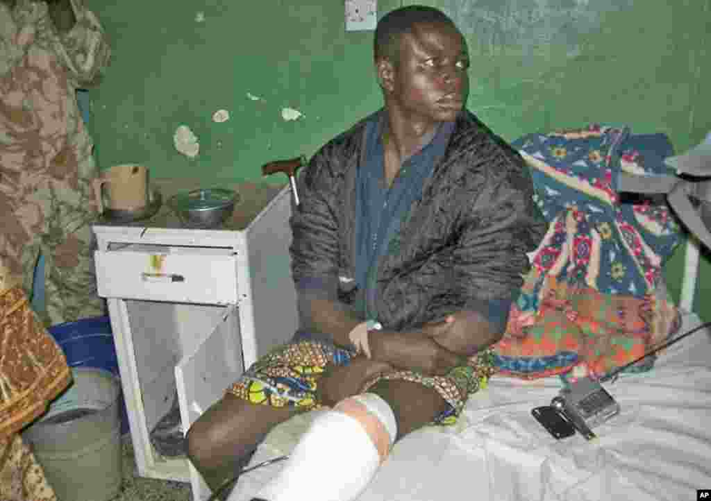 A survivor of a bomb blast at a church rests on a hospital bed in Nigeria's central city of Jos February 26, 2012.