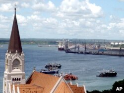 FILE - The Dar es Salaam Port can be seen with the St. Joseph's cathedral in the foreground, on May 22, 2006.