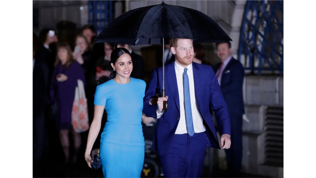 FILE -- Britain's Prince Harry and Meghan, the Duke and Duchess of Sussex, arrive at the annual Endeavour Fund Awards in London on March 5, 2020.