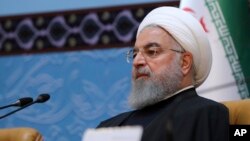 FILE - In this photo released by official website of the office of the Iranian Presidency, President Hassan Rouhani attends an annual Islamic Unity Conference in Tehran, Iran, Nov. 24, 2018. 
