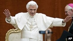 Pope Benedict XVI greets the faithful during the weekly general audience at his summer residence of Castel Gandolfo, in the outskirts of Rome. Benedict XVI lands Thursday in the Spanish capital of Madrid for a four-day visit to greet up to a million or mo