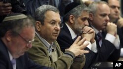 Israel's Defence Minister Ehud Barak (2nd L) attends the weekly cabinet meeting in Jerusalem April 10, 2011