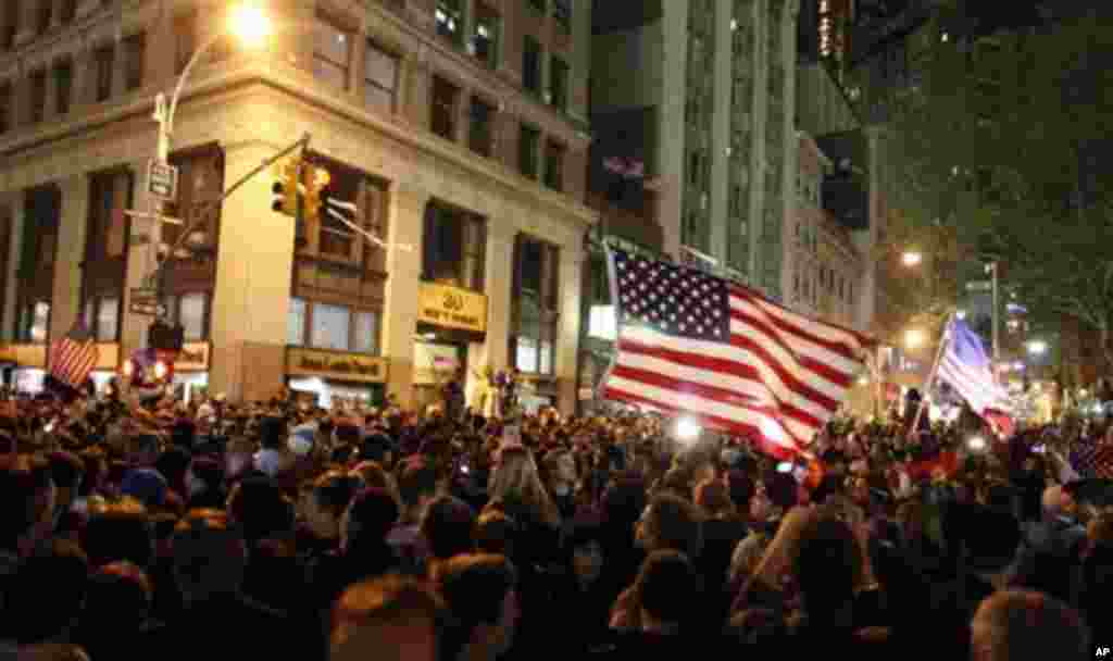 A large, jubilant crowd reacts to the news of Osama Bin Laden's death at the corner of Church and Vesey Streets, adjacent to ground zero, during the early morning hours of Tuesday, May 2, 2011 in New York (AP)