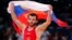 Russia's Dzhamal Otarsultanov celebrates after defeating Georgia's Vladimer Khinchegashvili on the final of the Men's 55Kg Freestyle wrestling during the London 2012 Olympic Games Aug. 10, 2012.