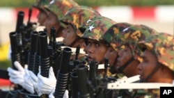 FILE - Military officers march during a parade to commemorate Myanmar's 78th Armed Forces Day in Naypyitaw, Myanmar, March 27, 2023. 