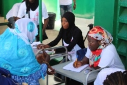 FILE - Women sign up for free breast and cervical cancer screenings organized by nonprofit Junior Chamber International at the Philippe Maguilen Senghor health center in Yoff, Dakar, Senegal, April 22, 2017. (S. Christensen/VOA)