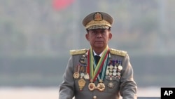 FILE - Gen. Min Aung Hlaing inspects officers during a parade to commemorate Myanmar's 78th Armed Forces Day in Naypyitaw, Myanmar, March 27, 2023. 