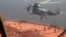 FILE - In this image from video released April 28, 2023, by the Iranian Navy, Iranian marines rappel onto the Advantage Sweet as they seize the oil tanker in the Gulf of Oman. The tanker was sailing toward international waters on July 11, 2024, tracking data show.