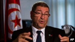 Tunisian Prime Minister Habib Essid speaks with The Associated Press during an interview ahead of a two-day conference in Madrid on combating the type of terrorism targeting foreign tourists that has hit his country twice over the last year, Spain, Tuesday, Oct. 27, 2015. 