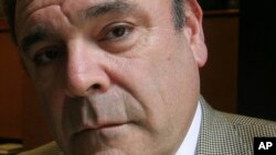 FILE - Gil Schwartz, head of corporate communications for CBS Corp., poses in his office in New York, June 28, 2006.