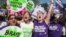 Para perempuan pendukung hak-hak aborsi merayakan keputusan Mahkamah Agung AS, di Washington, Senin (27/6).