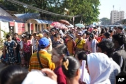 Family members wait to welcome released prisoners from Insein Prison Jan. 4, 2025, in Yangon, Myanmar.