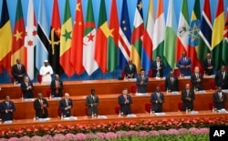 FILE - African leaders applaud Chinese President Xi Jinping, center, after his speech at the opening ceremony of the Forum on China-Africa Cooperation at the Great Hall of the People in Beijing, Sept. 5, 2024.