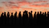 Some of the thousands of platinum mineworkers report for work at Lonmin, Anglo American Platinum, mine in Marikana, South Africa, following the resolution of the five-month strike.
