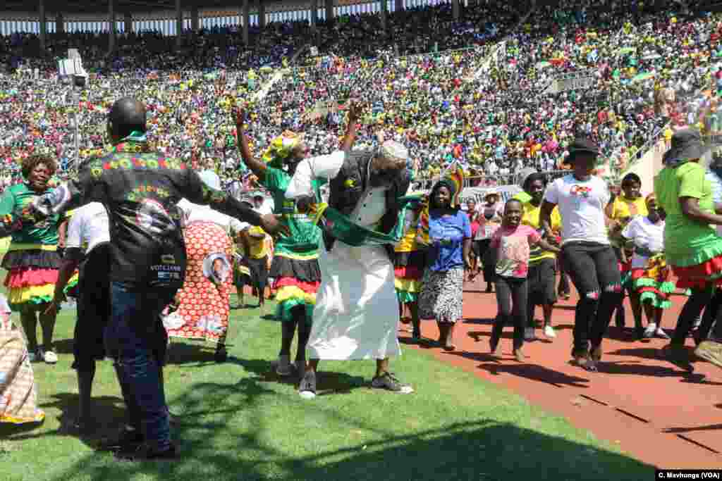 Ruling Zanu PF party supporters celebrate at a football in Harare after President Mnangagwa had been sworn into office, Aug. 26, 2018.