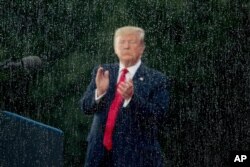 President Donald Trump applauds during an Independence Day celebration in front of the Lincoln Memorial, July 4, 2019, in Washington.