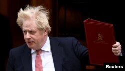 British Prime Minister Johnson leaves 10 Downing Street, in London, Feb. 21, 2022.