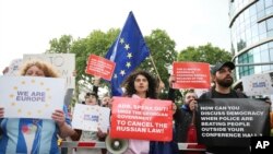 FILE —Demonstrators gather outside the Biltmore Hotel in Tbilisi where Asia Development Bank Annual set the 57th Annual Meeting of the ADB Board of Governors which is held to denounce the "Russian Law" in the center of Tbilisi, Georgia, on Friday, May 3, 2024. 