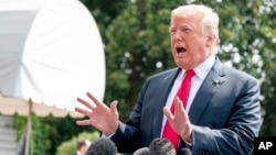 President Donald Trump speaks to reporters before boarding Marine One on the South Lawn of the White House in Washington, Aug. 17, 2018.