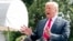 President Donald Trump speaks to reporters before boarding Marine One on the South Lawn of the White House in Washington, Aug. 17, 2018.